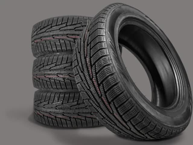 Stack of tyres showing the tread, checked for embedded objects